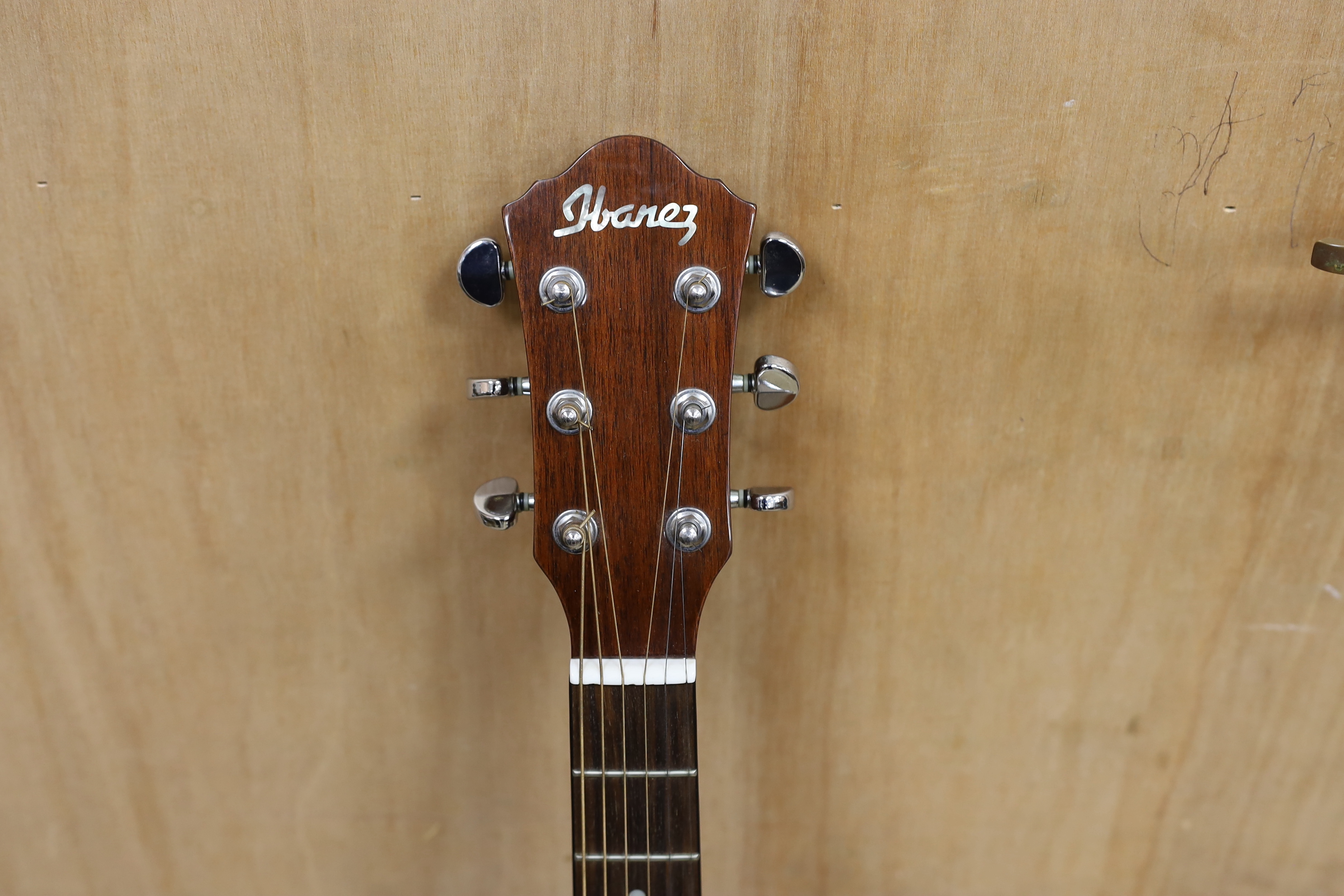 A cased Ibanez acoustic guitar